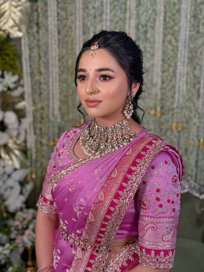 A three-quarter view against a soft-focus background, emphasizing the client's radiant look.