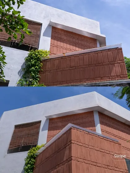 The facade of the Gifty Residence combines clean white plaster with the earthy red of terracotta blocks, creating a modern yet warm exterior. The bamboo blinds add another layer of natural texture.