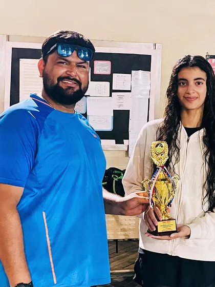 Celebrating another gold medal with Veera Prathambir at the School State Swimming Championship in Ambala. Her consistent victories are a hallmark of our training program.
