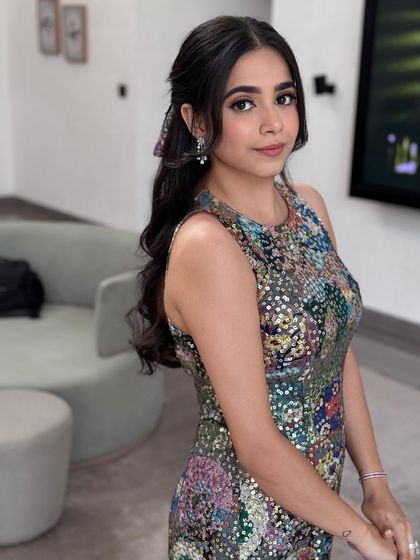 A lovely portrait with a simple and chic half-up hairstyle.