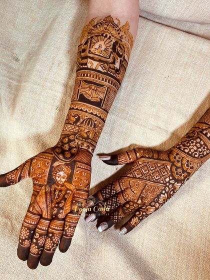 The groom's mehendi, featuring a portrait of himself, perfectly complementing his bride's design.