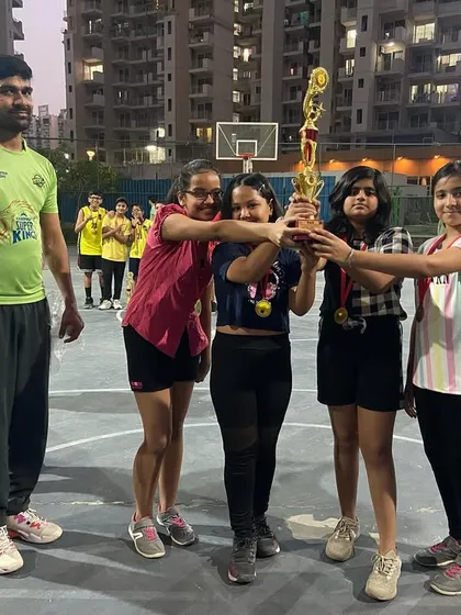 Standing proud with the girls' championship team. We train them to be strong, confident, and competitive.