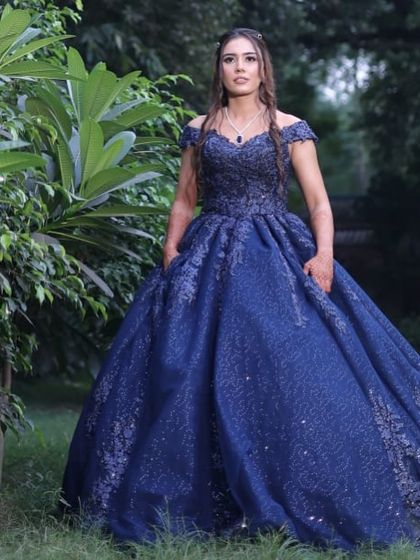 A full-length view that captures the grandeur of the gown and the complementary hair and makeup.