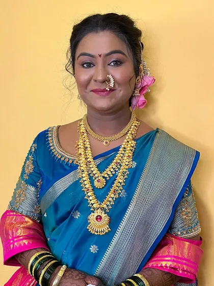 The makeup is soft and enhances her natural beauty.