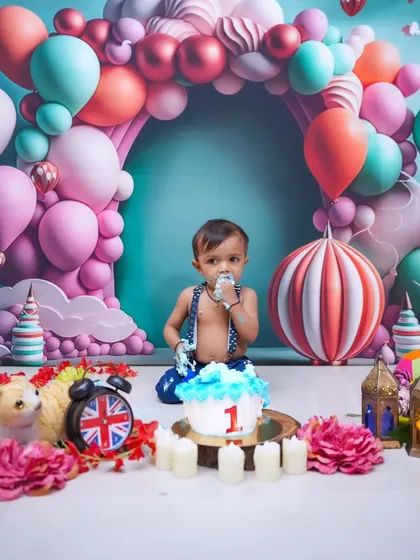 Let them eat cake! A first birthday cake smash is pure, messy fun. This colorful balloon arch setup is one of many I offer to capture the joy and personality of your little one as they celebrate a huge milestone.
