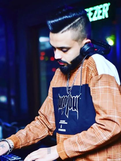A focused shot of me at the console at Badmaash Lounge, getting the mix just right for the crowd.