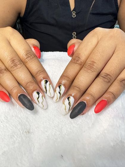 The same bold matte set, showing how different art can be applied to each nail for a unique combination.