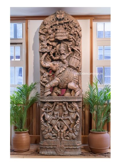 An impressive 83-inch wall mount showing Raj Bhavani on an elephant. This complex, multi-layered carving tells a story of royalty and power, perfect as a statement piece for a large entryway or hall.