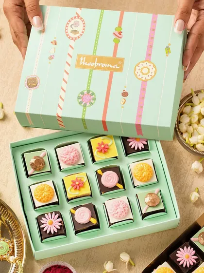 This festive shoot was all about creating a celebratory mood. We paired these beautiful mint and blush-toned boxes with fresh jasmine and subtle gold details to weave in a sense of cultural charm and warmth, making the sweets feel like a true gift.