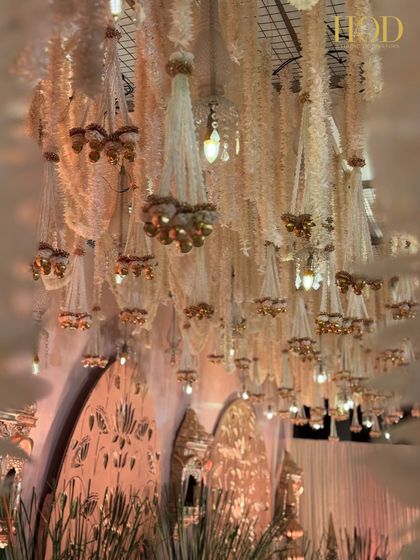 A view of the floral chandelier ceiling from below, creating a magical, immersive experience for anyone standing underneath.