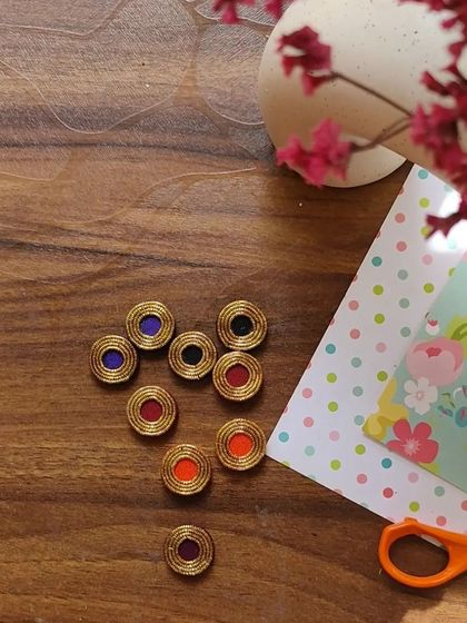 A glimpse of my work-in-progress materials. You can see colorful fabric components, beads, threads, and hand-painted pieces all waiting to be turned into beautiful jewelry.