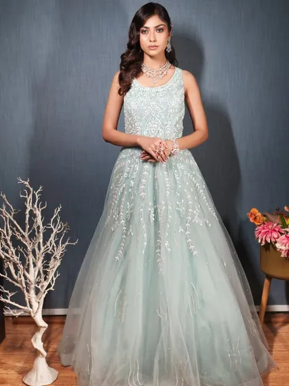 A full-length view of the mint green gown, showing its elegant A-line silhouette.