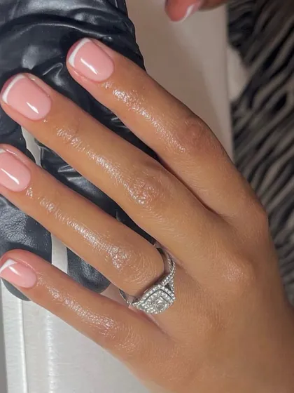 A close-up showing the importance of cuticle care and moisturizing for the perfect nail photo. This classic French manicure looks flawless from every angle.