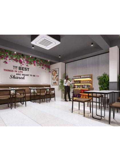 A comfortable seating area with a motivational quote on the wall, "The best things in life are meant to be shared."