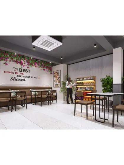 A comfortable seating area with a motivational quote on the wall, "The best things in life are meant to be shared."