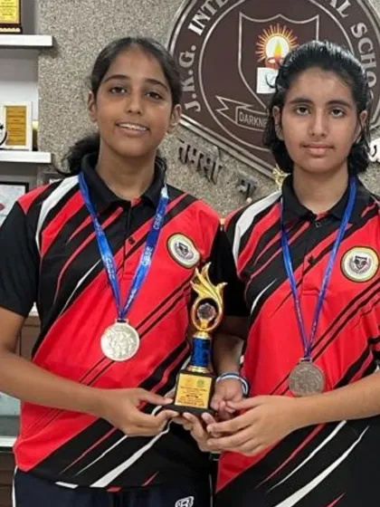 Vaishnavi Trivedi and her teammate with their silver medals and trophy from the U-19 Girls Team event at the CBSE Cluster Championship.