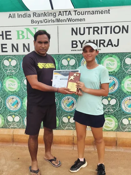 A student receiving her award. Every victory, big or small, is a step in the right direction.