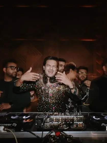 The groom takes the DJ console at the Arabian Sufi Night. The moody, warm lighting and intricate patterns in the decor helped create a rich, cinematic, and soulful ambiance.
