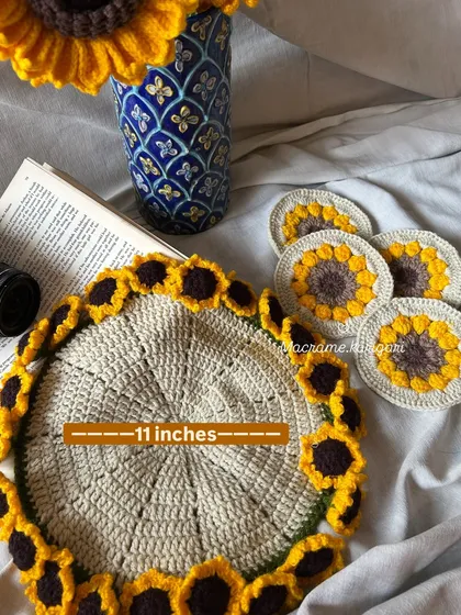 Our crochet Sunflower table set is one of my favorite designs. This cheerful set includes a large 11-inch centerpiece mat and matching coasters, bringing a little bit of sunshine to your table.