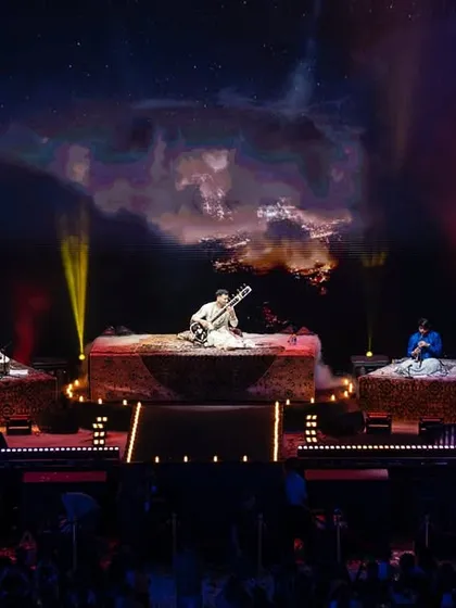 On stage with my full band of incredible musicians. For larger shows, we expand the sound with bass, guitar, keys, and a variety of Indian and Western percussion to create a rich, orchestral fusion.