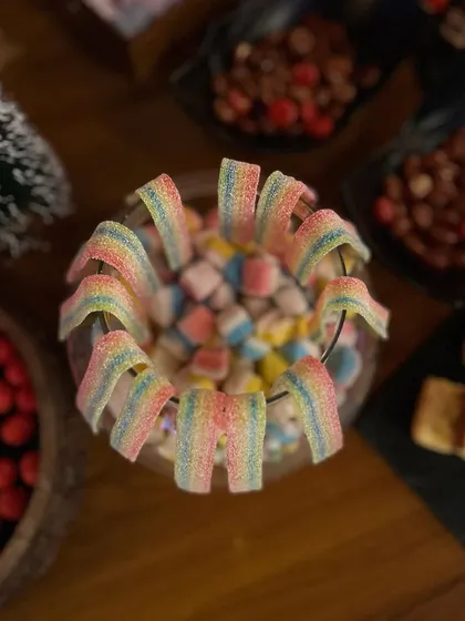 Rainbow candy belts adding a pop of color to the dessert spread. I pay attention to every detail to make the setup as magical as possible.