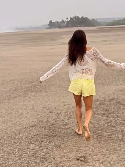 Walking on the beach with my feet in the sand. These simple moments in nature, feeling the earth beneath me, are deeply grounding and a form of moving meditation for me.