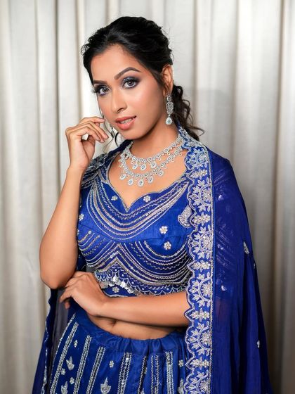 A closer look at our royal blue lehenga. The detailed silver embroidery on the blouse and dupatta border adds a touch of luxury, ensuring you look and feel fabulous.