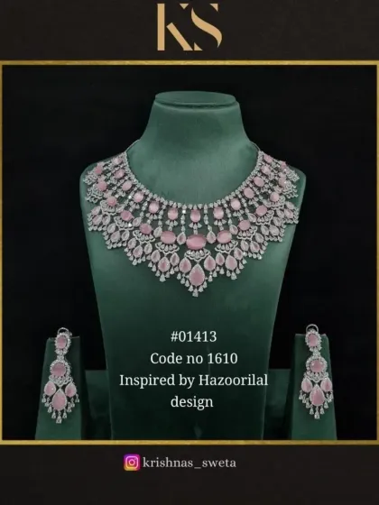 This Hazoorilal-inspired set in a delicate pastel pink is perfect for a bride's engagement or reception. It's romantic, elegant, and incredibly sparkly.