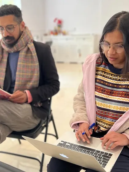 Participants deeply engaged during the Narrative Fiction workshop. We create a focused environment where you can immerse yourself in the craft of writing, whether on a laptop or with a classic notebook.