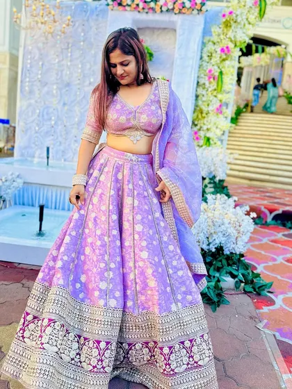 This lavender lehenga with traditional motifs is a beautiful blend of classic and contemporary. The light organza dupatta completes the look.