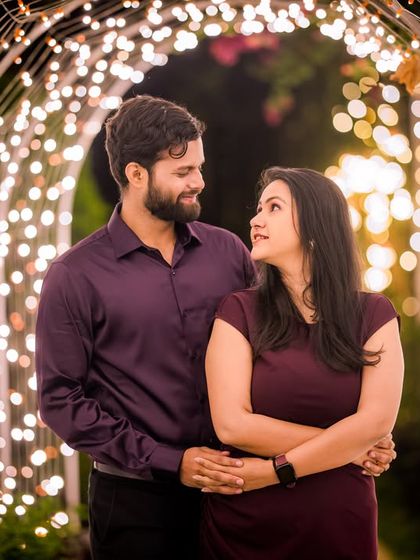 An intimate portrait within our tunnel of lights, where the bokeh effect of the fairy lights adds a dreamy quality to this couple's photo.