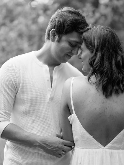 A close, intimate portrait where the couple rests their foreheads together. This black and white image beautifully captures their deep connection and shared emotions.