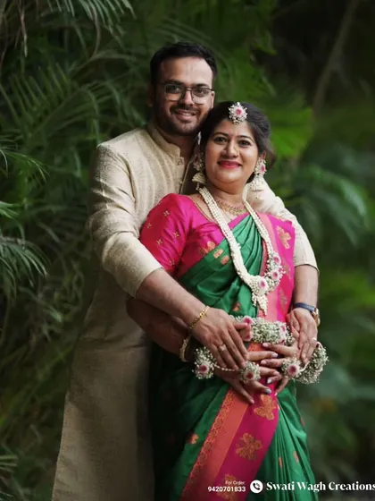 A sweet couple portrait from a baby shower. Her floral jewellery adds a touch of natural elegance to their special day.