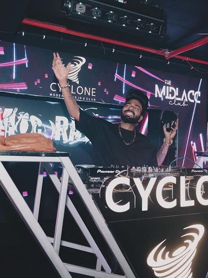 Celebrating with a cake and sparklers behind the DJ booth at Cyclone, Nagpur.