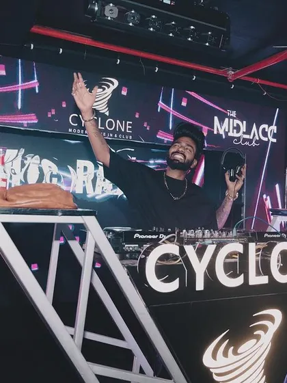 Celebrating with a cake and sparklers behind the DJ booth at Cyclone, Nagpur.