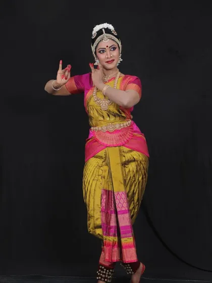 Brinda looking lovely in her costume for her Arangetram. The choice of color and design for the saree is a collaborative process to ensure it complements the dancer perfectly.