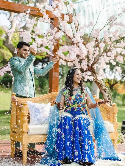 Moments like these are why I do what I do. We created a whimsical 'Whispers of the Orient' theme with a cherry blossom tree as a centerpiece, and it became the perfect spot for the couple to share a quiet, joyful moment. The decor is the canvas for your memories.