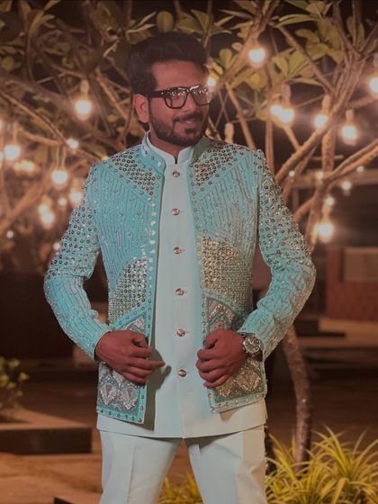 Dressed for a sundowner wedding in a beautiful pastel blue jacket with heavy sequin work. It’s a modern, glamorous take on ethnic wear.
