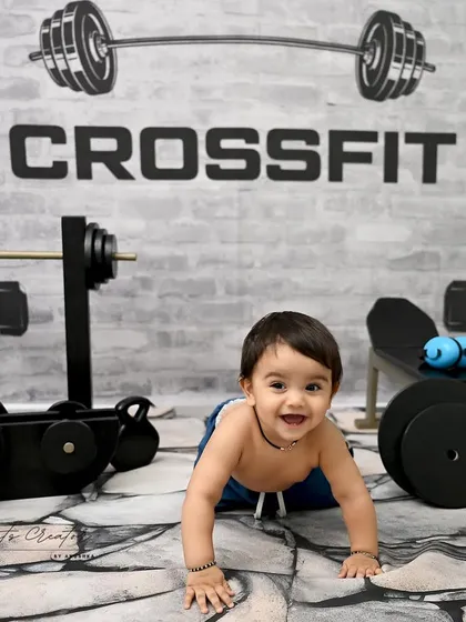 A crawling-level view of our mini gym. This little guy's happy expression shows just how much fun these creative and interactive setups can be for babies.