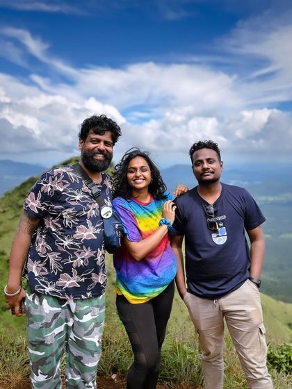 Posing on the trail with a beautiful view of the valley.