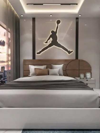 The centerpiece of this room is the custom headboard with an illuminated Air Jordan logo, perfect for a basketball fan. We love creating personalized spaces that reflect your passions.