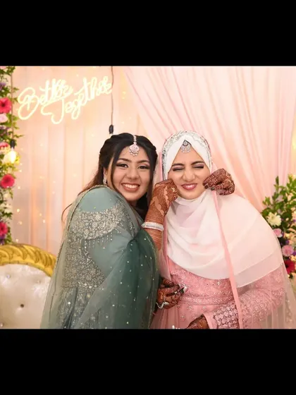 The bond between sisters and friends is so special. This happy, candid shot from an engagement party captures the excitement and love surrounding the bride-to-be.