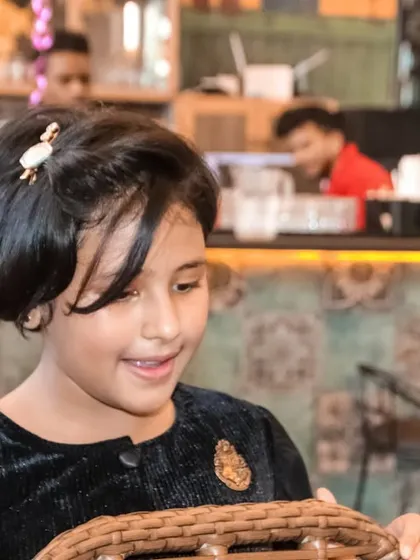 A candid shot of a young girl enjoying the party atmosphere. I take natural-looking photos of guests throughout the event.
