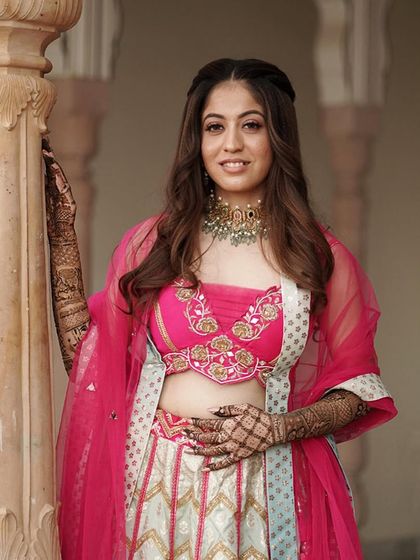 A portrait of my beautiful mehendi bride. The soft waves in her hair and the dewy makeup perfectly complement her bright and happy vibe.