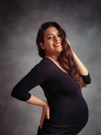 There is something so naturally beautiful about an expecting mother. This simple, happy portrait captures that perfectly.