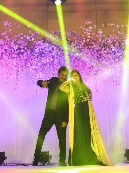 Striking a pose under the spotlights. We ensure our choreography includes powerful, memorable moments that look amazing both live and in photos.