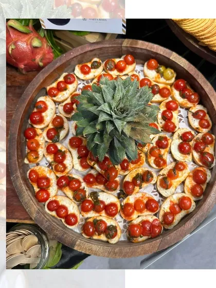 A feast for little foodies. This grazing table for a kids' party is packed with fun, flavorful nibbles like cherry tomato bruschetta and mini tortilla wraps, all presented in an engaging way.