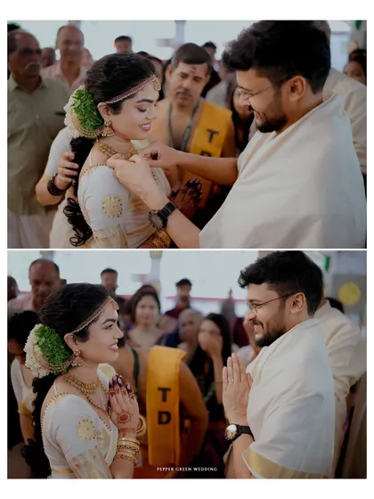The sacred moment of the groom tying the thali around the bride's neck, a pivotal ritual in a Hindu wedding ceremony.