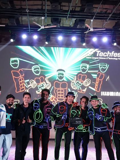 A group photo on stage with the entire performing crew. Celebrating a successful segment together is always a great feeling.