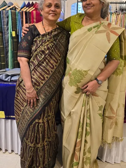 A moment with a friend at an exhibition. These gatherings are a great source of inspiration and a chance to connect with fellow women in business.
